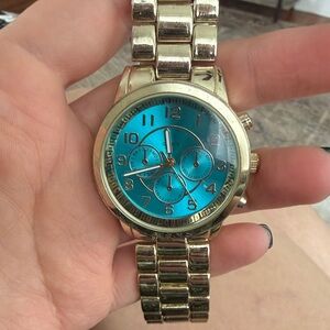 Gold Tone Bracelet Watch with Bright Teal Dial
